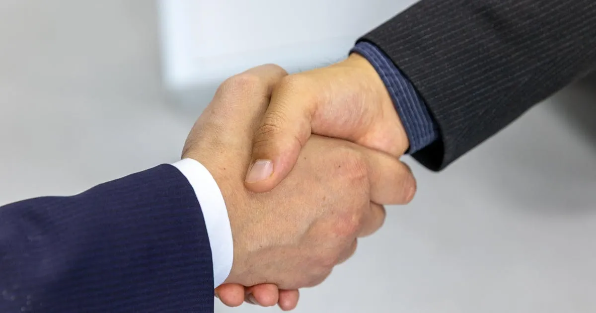 Businessmen shaking hands on EOR partnership