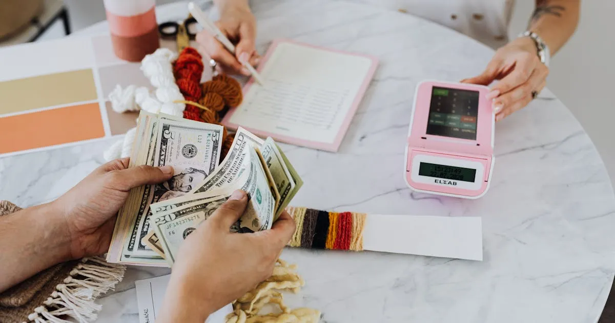 A laptop showing payment rails and global currencies for paying international contractors
