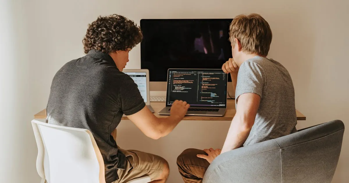 React developers in India pair-programming on a Next.js front-end with TypeScript code on screen