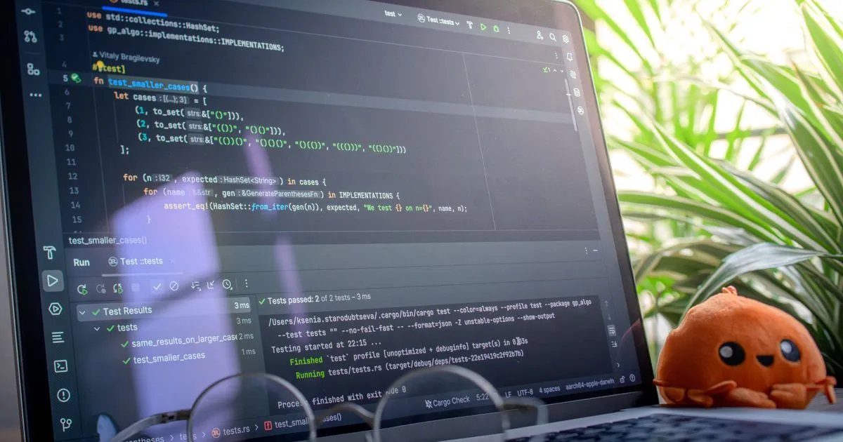 Open laptop displaying code — QA engineer test review