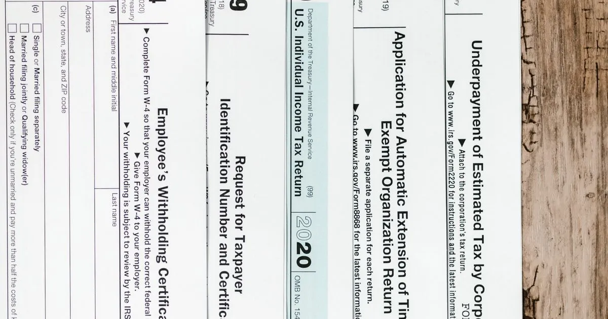 Income tax forms laid out on a desk, Form 16 TDS certificate