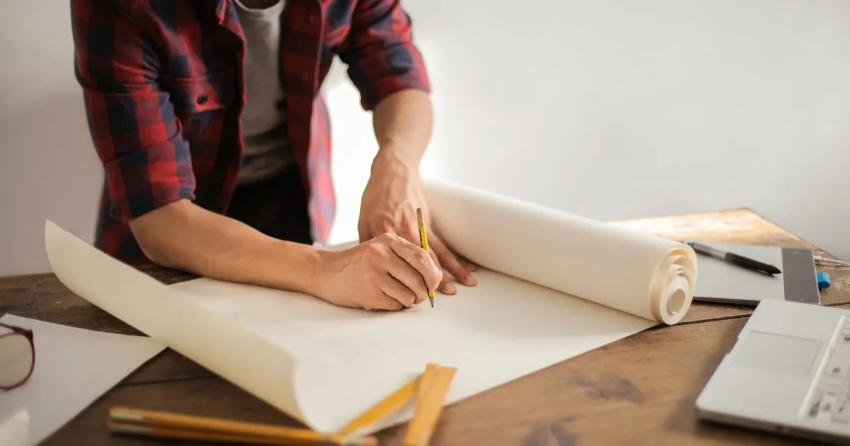 Two professionals reviewing contract risk-allocation language