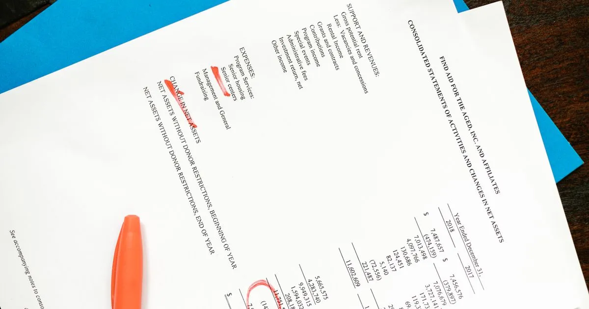 Financial documents with highlighted sections, payroll tax review
