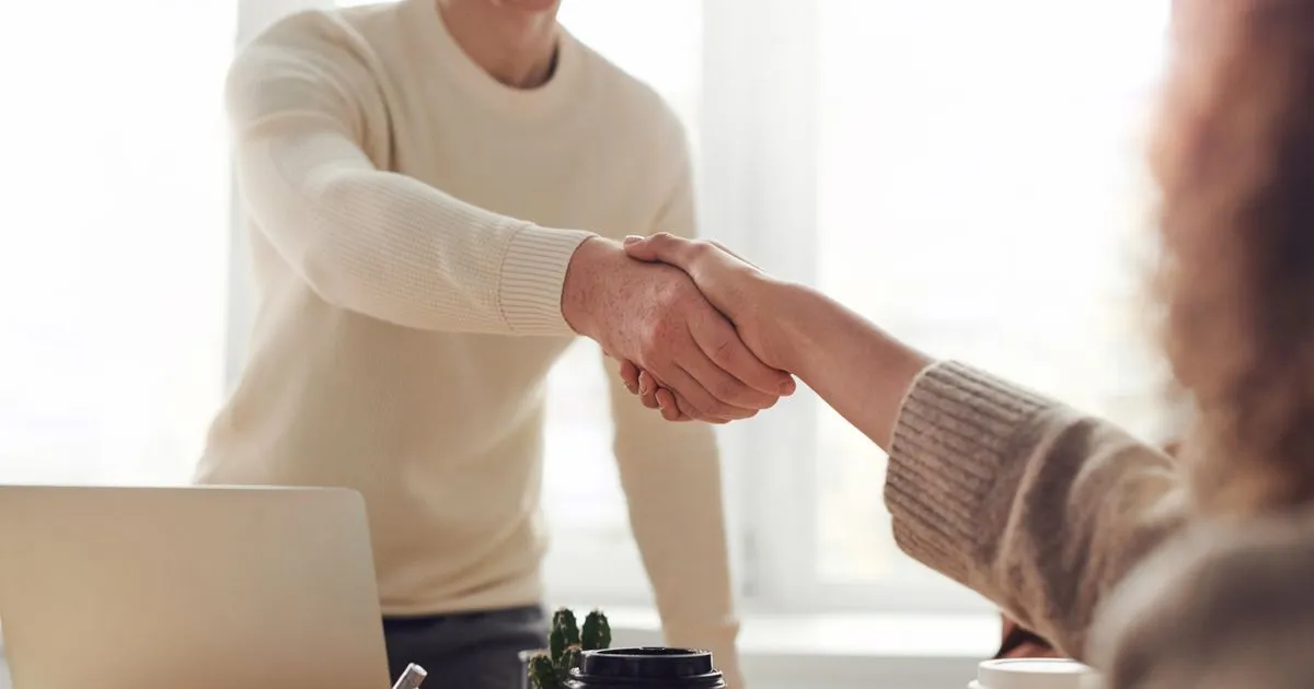 Independent contractor reviewing a service agreement at a desk