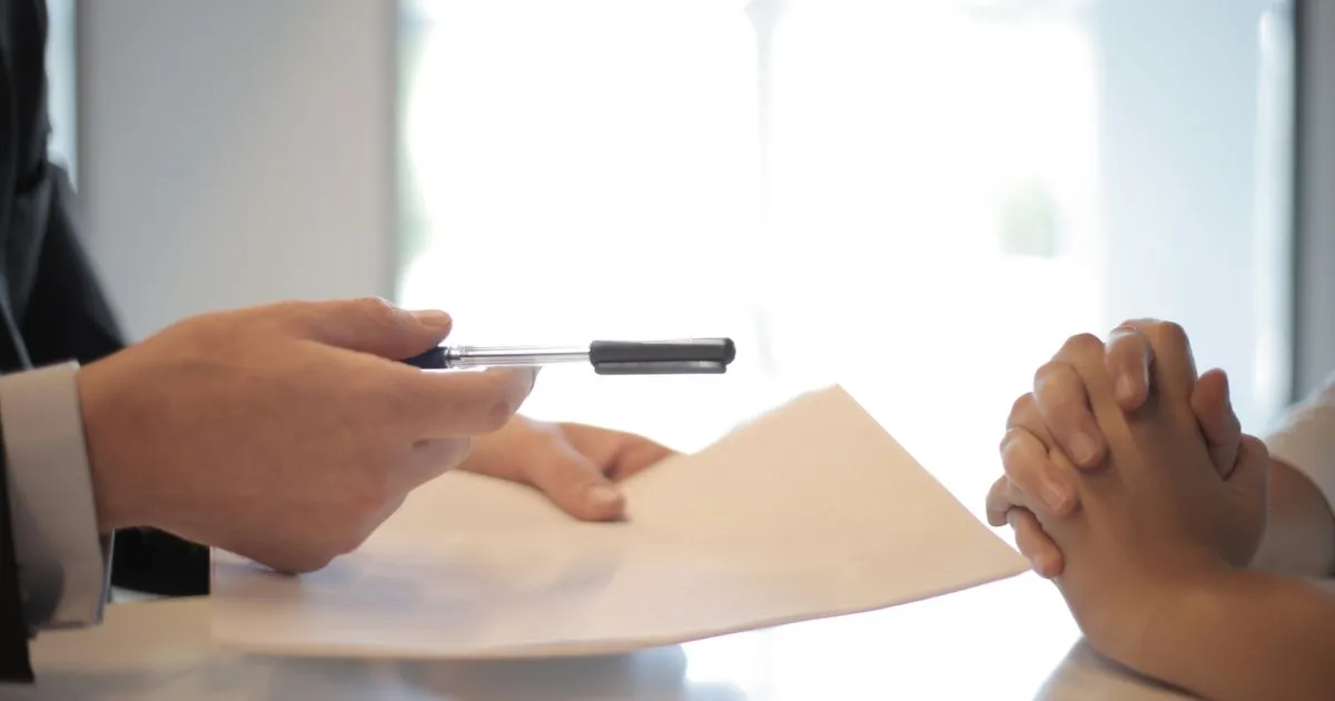 Project planning document on a desk with milestones and deliverables