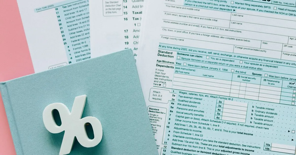 Tax documents with percentage symbol, Tax Deducted at Source